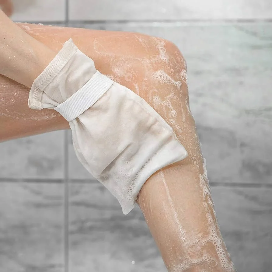 Utilize an exfoliating glove for removing  tan
